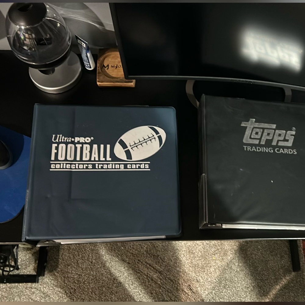 Hundreds of Topps and Panini football trading cards.